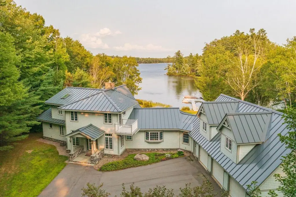 Aerial view of the front of the house and circular drive at 17 Point Road, Wilton Maine