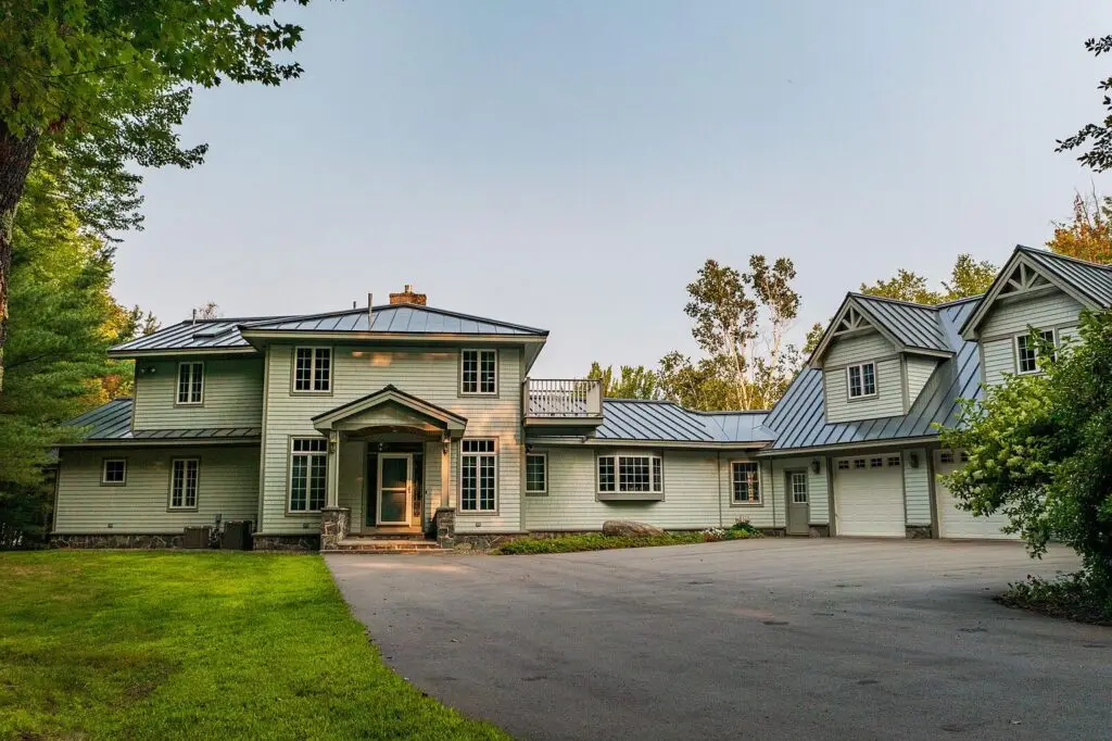 Front of the Wilson Lake house with paved circular driveway