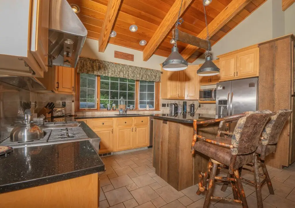 Eat-in kitchen with full island and custom fractal-burn cabinetry