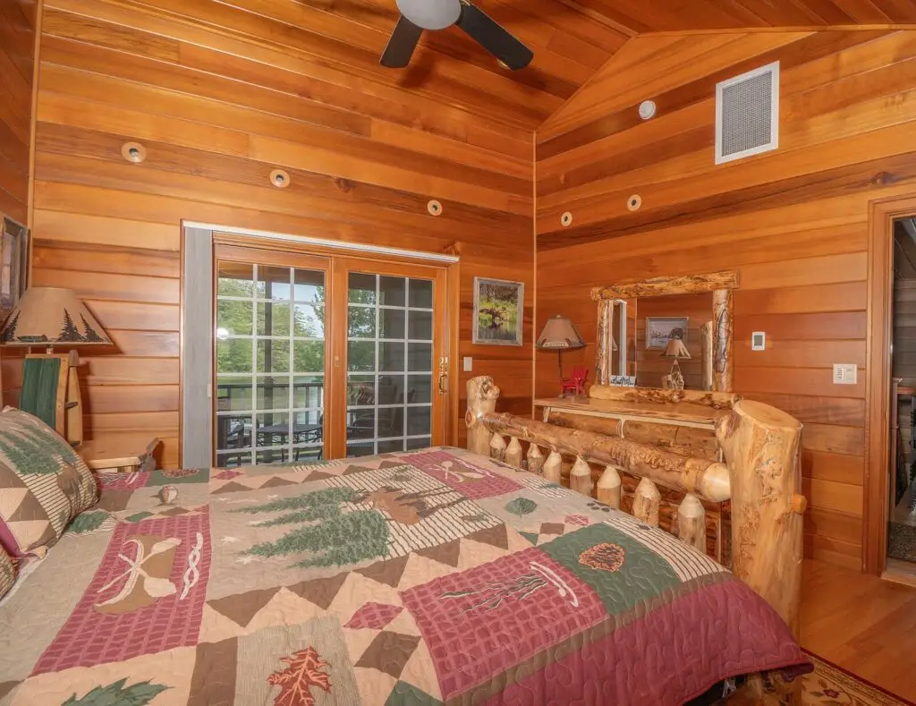 Bedroom furnished with custom Amish rustic log furniture