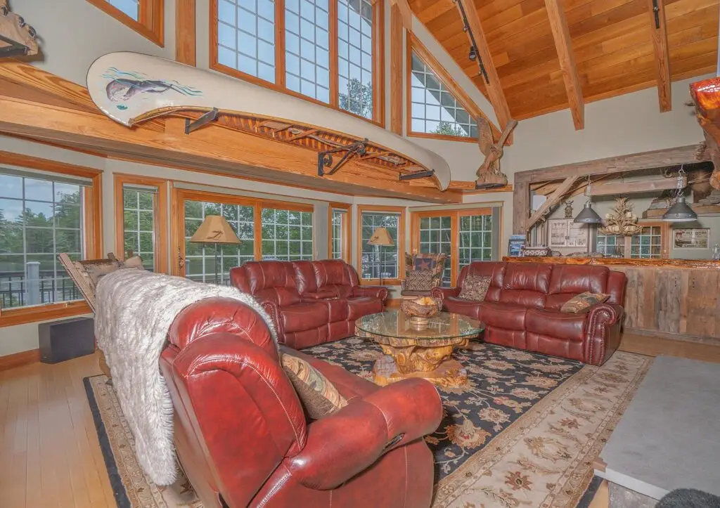 Great room seating with leather sofas facing the fireplace