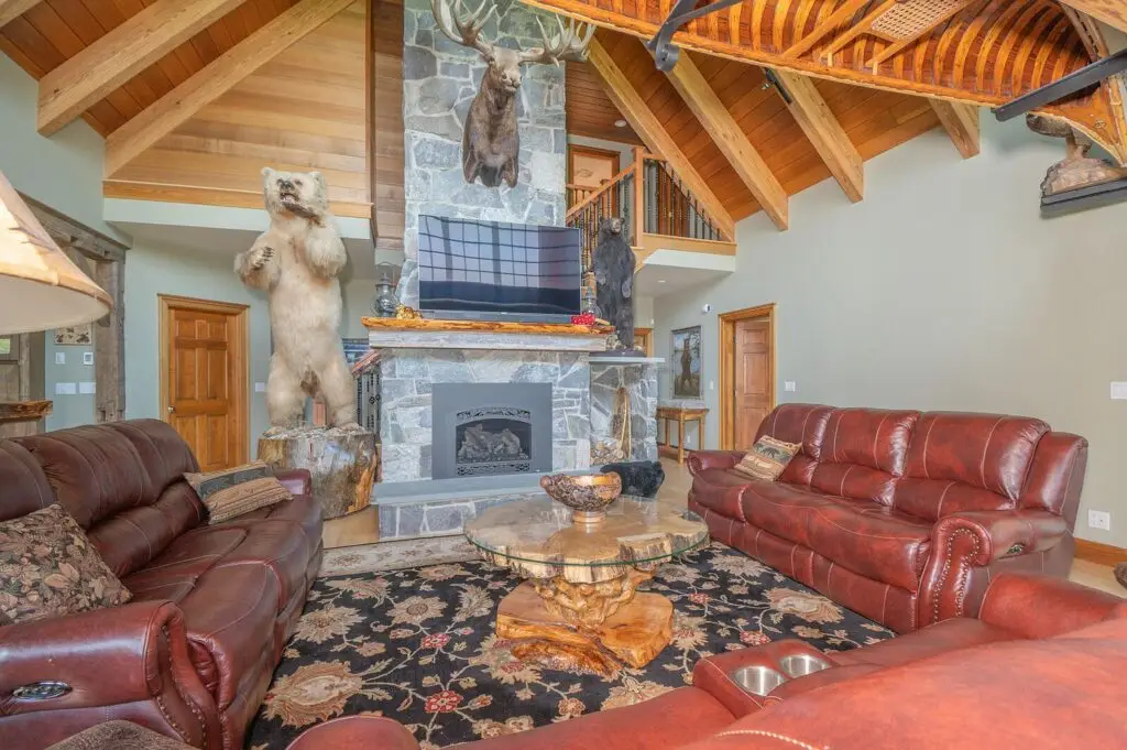 Stone fireplace in the great room with carved bear detail