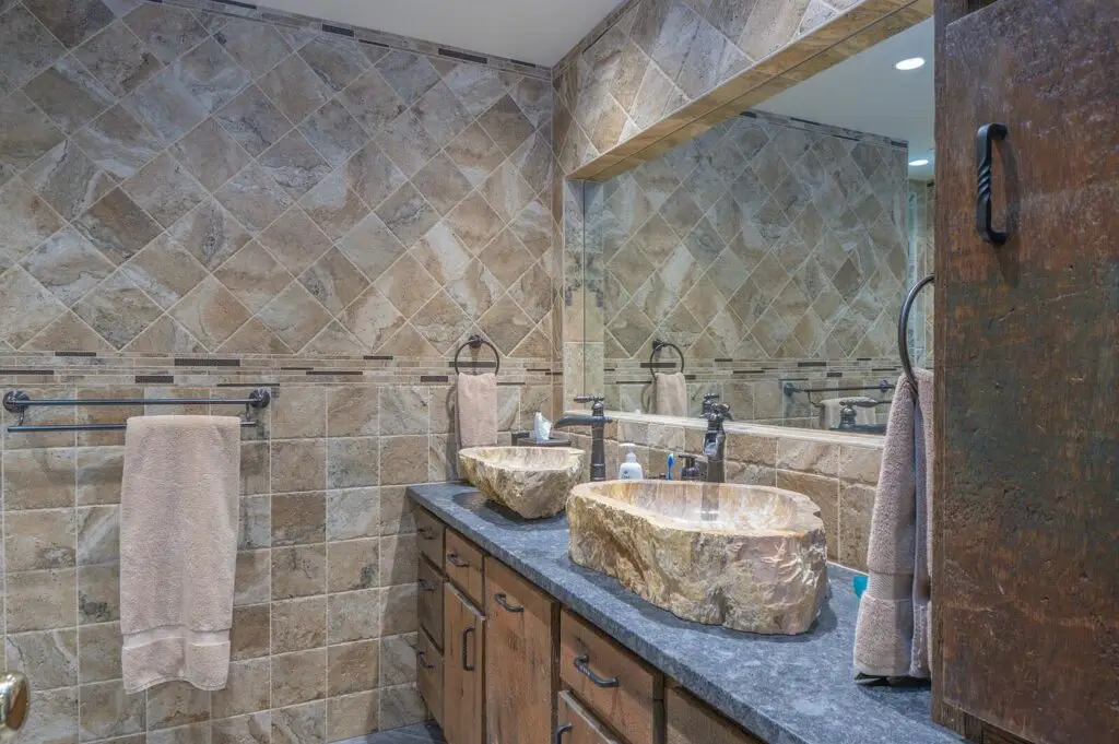 Bathroom with artisan stone vessel sinks