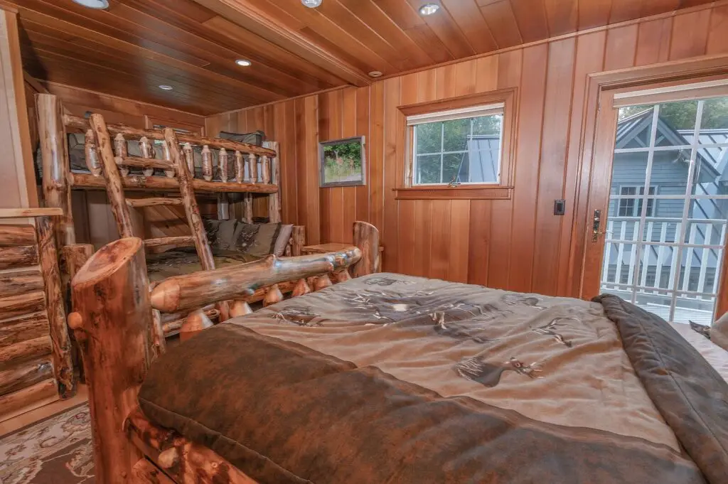 Guest bedroom with bunk beds and a full bed