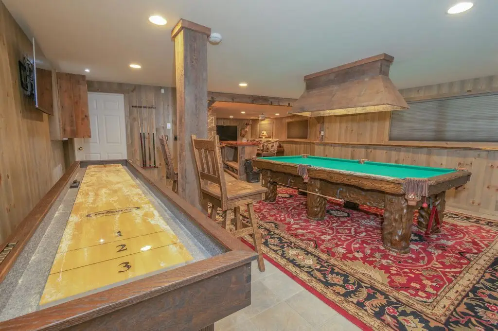 Lower-level game room with shuffleboard table