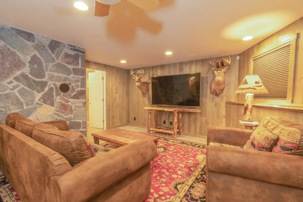 Finished walkout lower level family room with television
