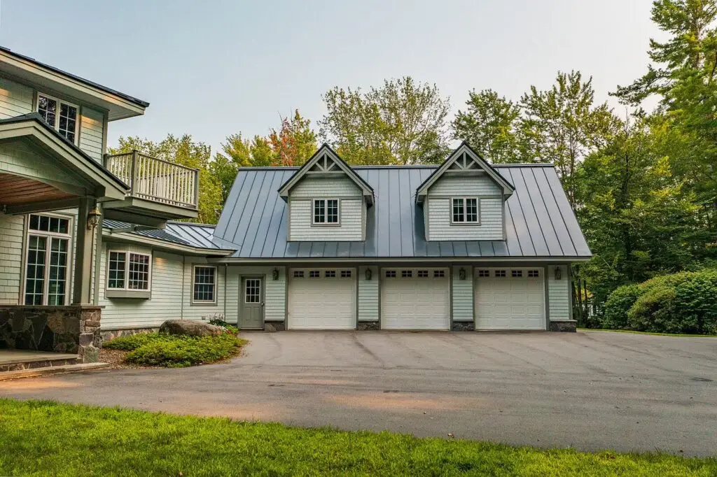 Three-car heated garage with four-season apartment above