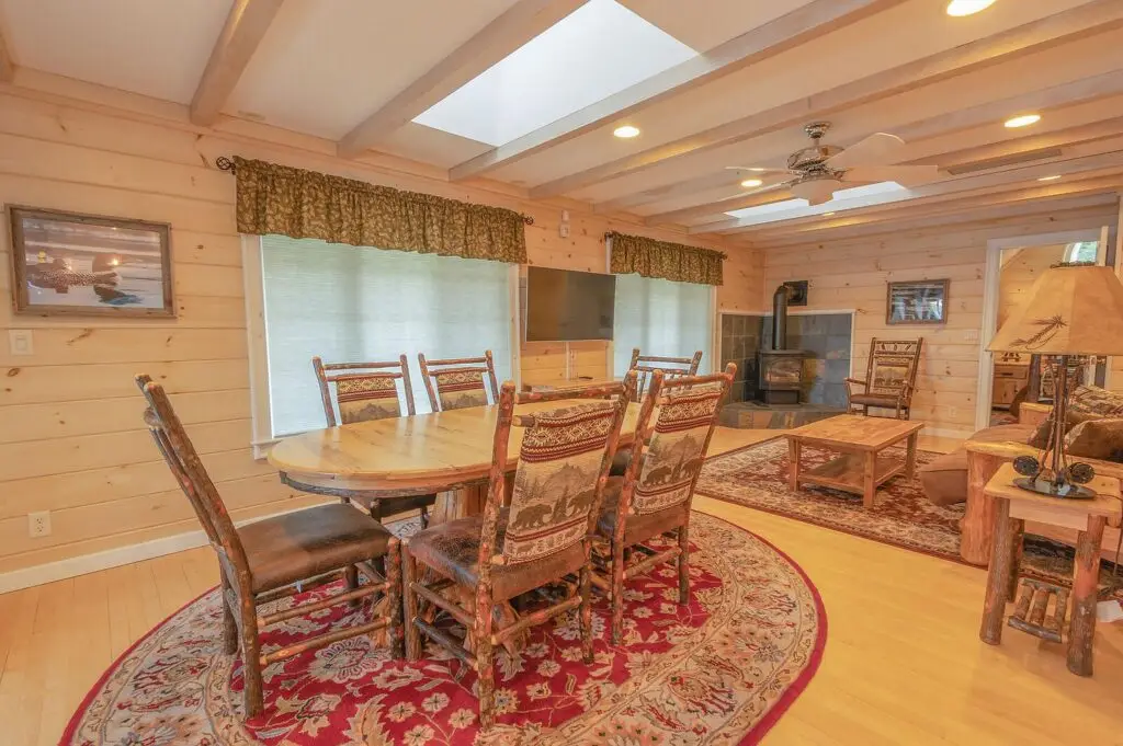 Guest apartment living and dining space with wood stove