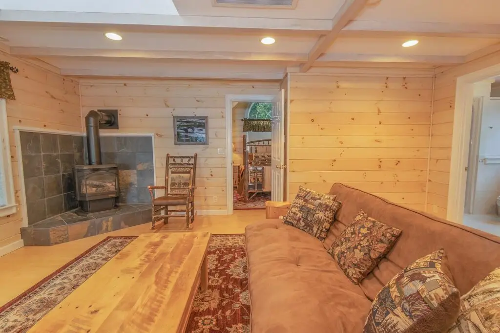 Guest apartment living room centered on the wood stove
