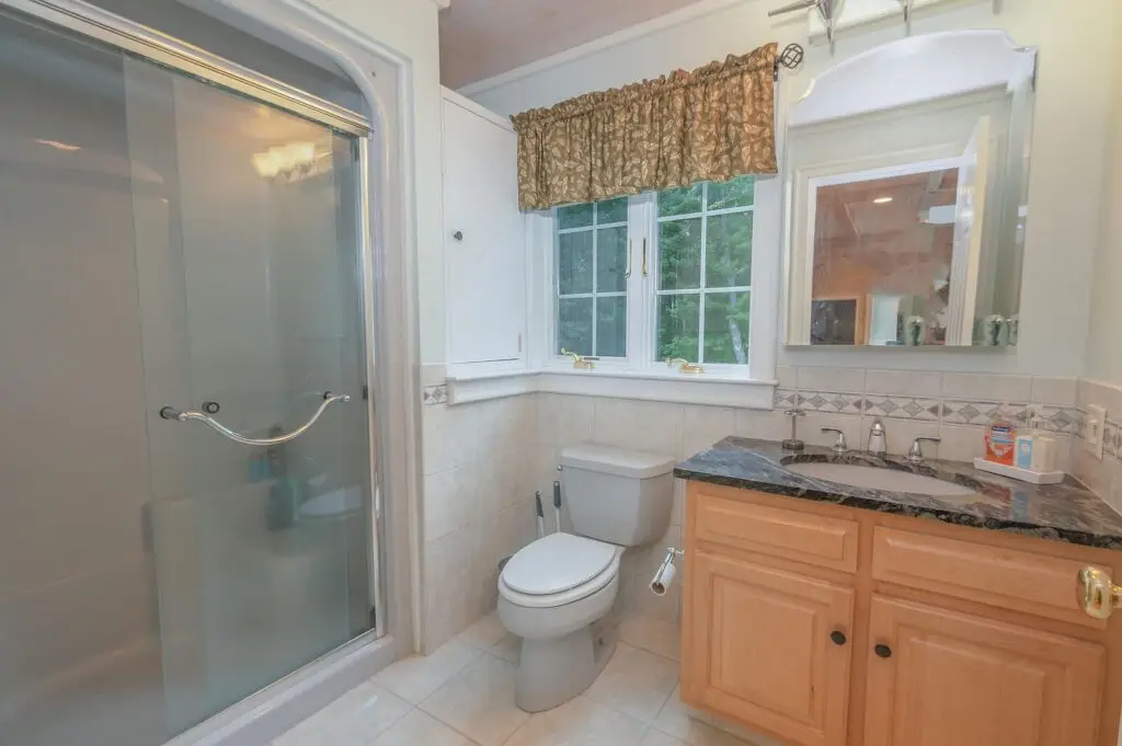 Guest apartment bathroom with tub and shower