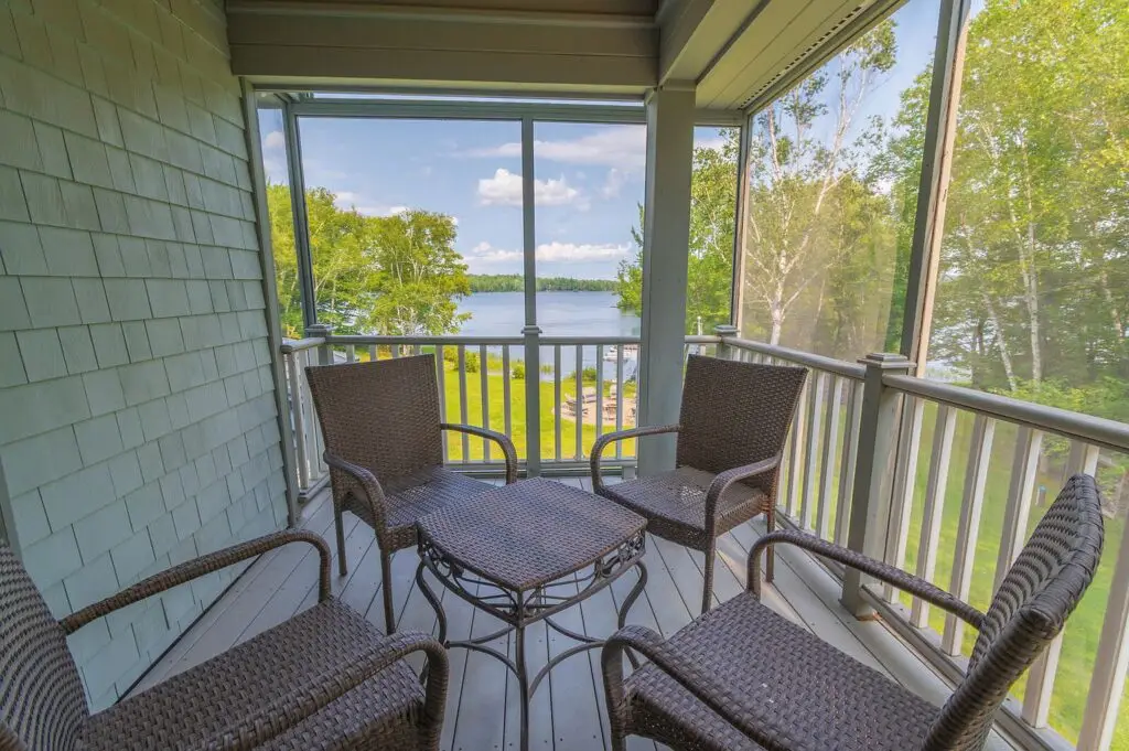 Screened porch, lawn and firepit overlooking Wilson Lake at 17 Point Road