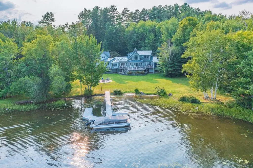 Aerial view of the dock, boat and lawn at 17 Point Road