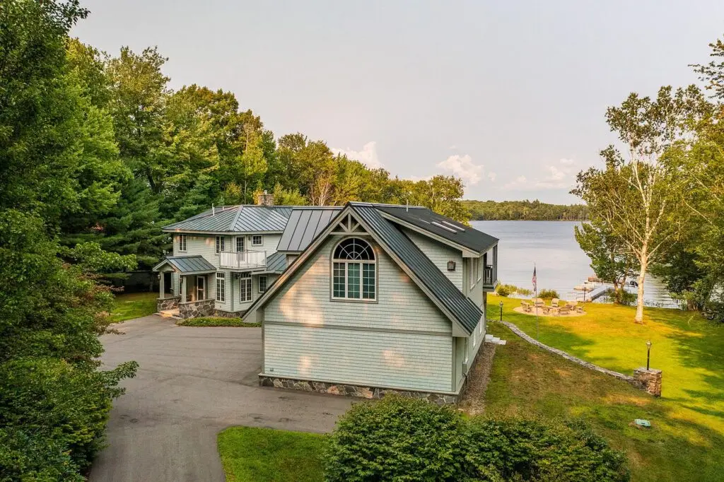 Aerial view of the lawn, firepit and shoreline on Wilson Lake