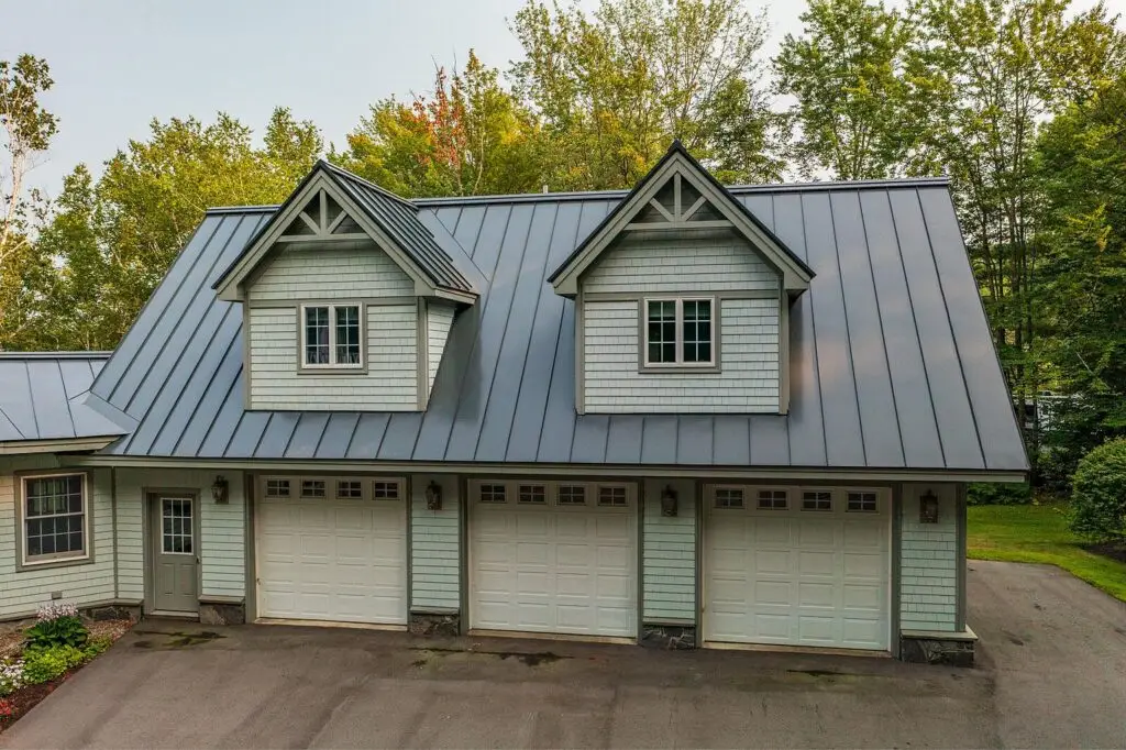 Exterior of the three-car garage with standing-seam metal roof