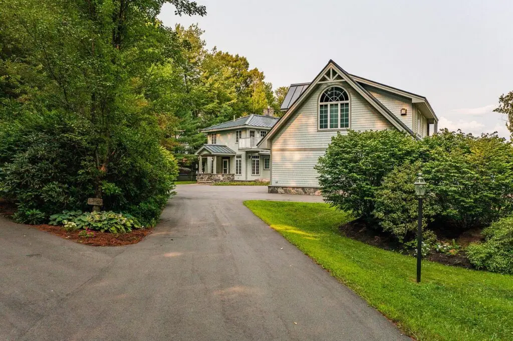 Driveway approach showing the arched window above the entry